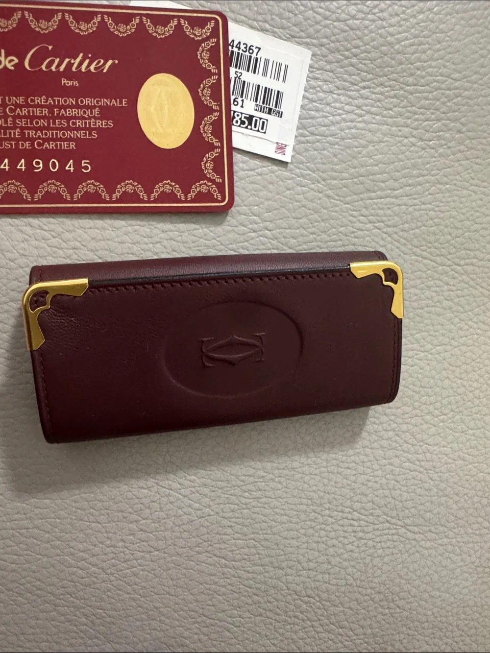 Cartier Burgundy Leather Key  Holder with Gold Accents.